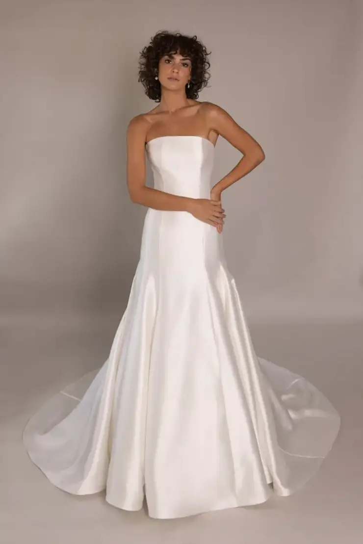 model is wearing a strapless a-line bridal gown