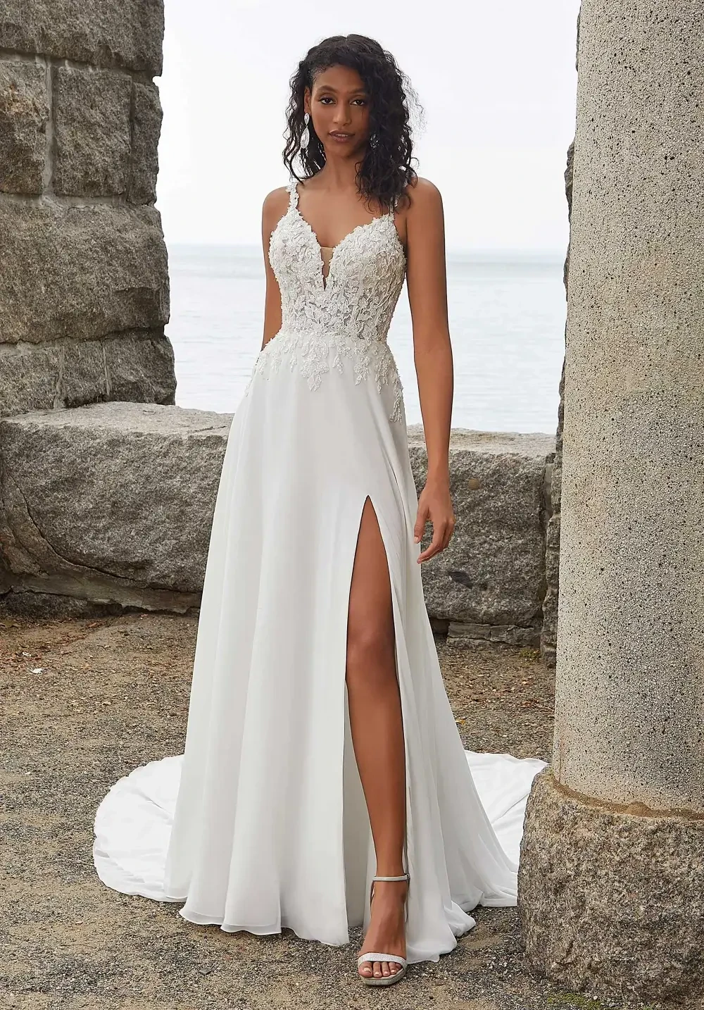 model is wearing a sleeveless breezy a-line gown
